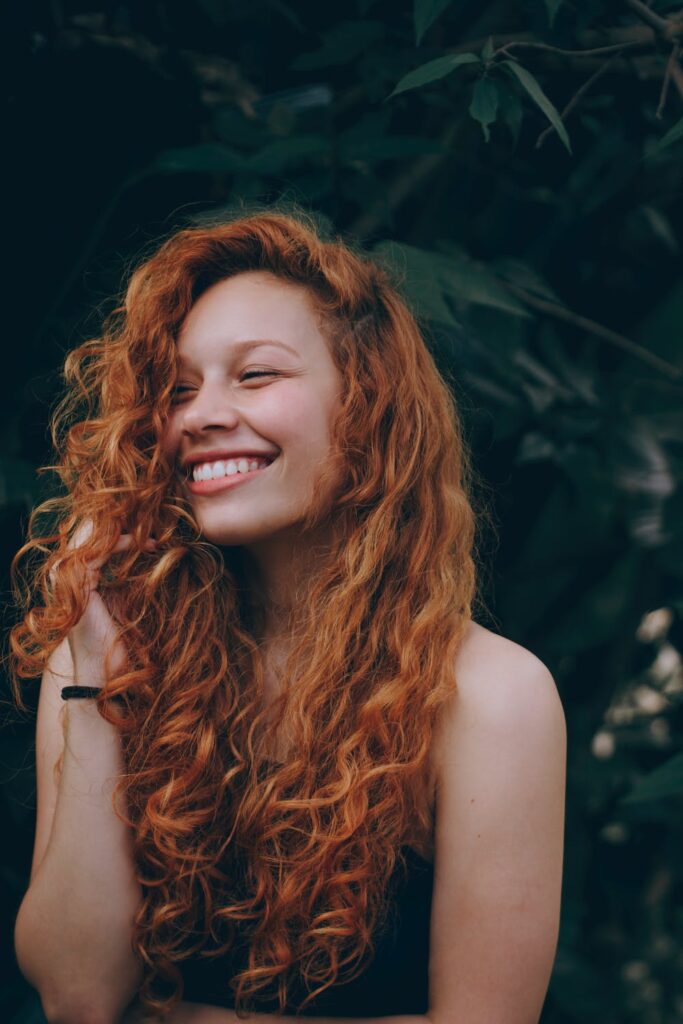 Lady with long red wavy curly hair